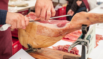 Fine serrano ham at market stall