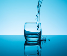 Сreative splashing water in the glass