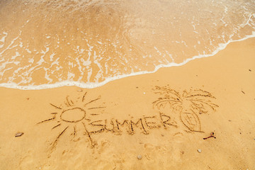 Sun drawing in the sand of ocean / sea beach.
