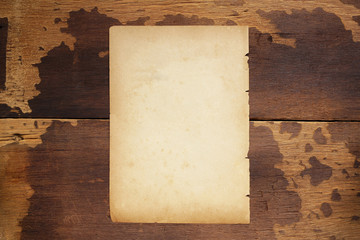 Old brown paper texture on wooden table