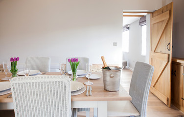 table setting with tulips in bright kitchen