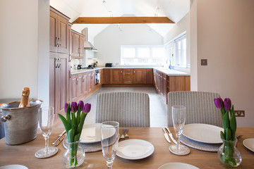 table setting with tulips in bright kitchen