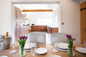 table setting with tulips in bright kitchen