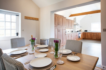 table setting with tulips in bright kitchen