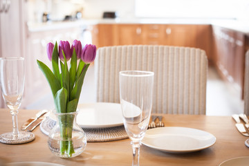 table setting with tulips in bright kitchen