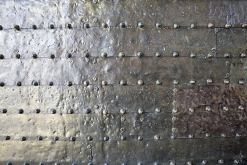 metal background of  silvered surface with rivets