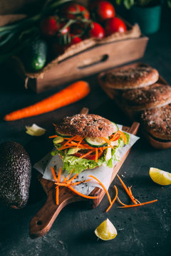 Vegetarian sandwich with lettuce, cucumber, carrot tomato anda avocado