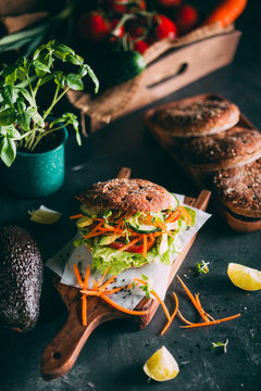Vegetarian sandwich with lettuce, cucumber, carrot tomato anda avocado