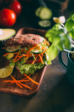 Vegetarian sandwich with lettuce, cucumber, carrot tomato anda avocado