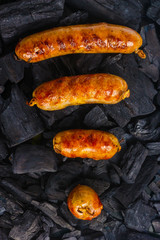 Sausages on coals as an icon Wi-Fi