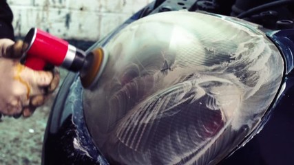 Close up car lamp or front headlight polishing, renewed headlamp
