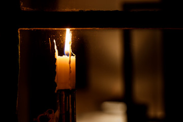 Candle in rustic window