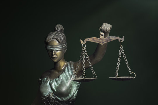 Lady Justice on emerald background