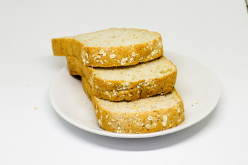 Slice of breads on the white disc isolate background
