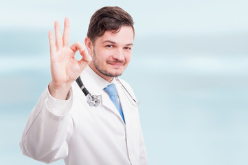 Portrait of medical doctor showing ok sign