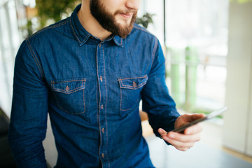 Portrait of man use mobile phone in cafe