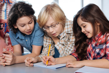 Engaged sociable kids discussing something