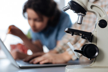 Engaged charming gentlemen analyzing experiment data