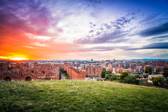 Madrid cityscape at sunset with purple clouds
