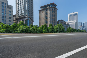 empty asphalt road front of modern buildings