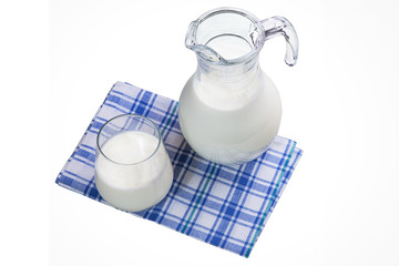 Jug and glass of milk isolated on white