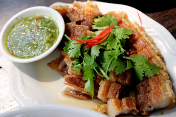 Deep fried pork belly serving with spicy dipping sauce