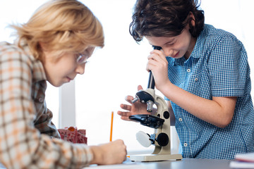 Curious future scientists exploring micro worlds