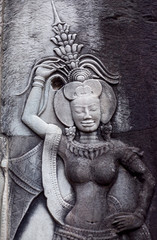 Fototapeta na wymiar Ancient reliefs at Angkor Wat Temple, Cambodia