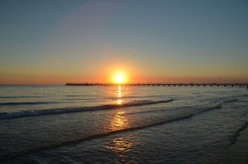Fototapeta premium Sunset in autumn evening over Black Sea in resort village