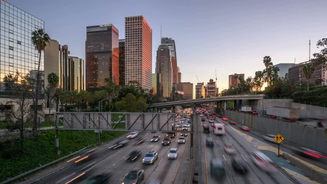 time lapse of Los Angeles city freeway traffic at sunset 