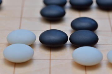 Fototapeta na wymiar GO game. GO is an abstract strategy board game for two players, in which the aim is to surround more territory than the opponent.