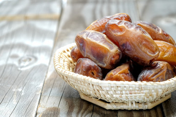 Date palm on wooden floor.