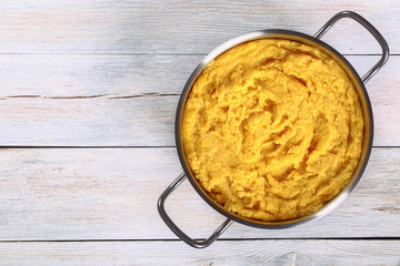 basic polenta in metal pot, top view