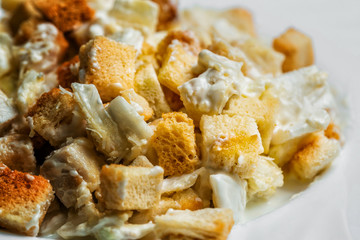 Caesar Salad on breadcrumbs, in white plate. selective focus