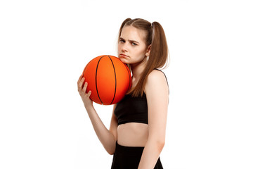 Young pretty girl posing with basketball, isolated on white background.