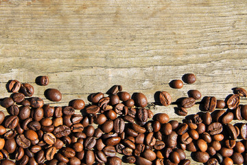 Coffee beans on wooden background
