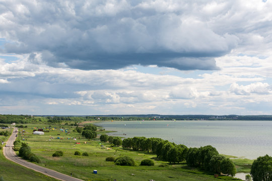Sports and recreation in auto kemping on Plesheevo lake resort, stormy weather dark clouds in the sky..