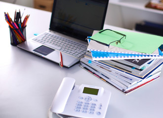 Group of multicolored office folders and glasses