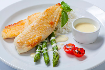 delicious fish steak with green asparagus and rice