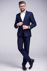 Handsome man in dark blue suit and white shirt