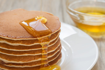 Fresh and delicious pancake with honey