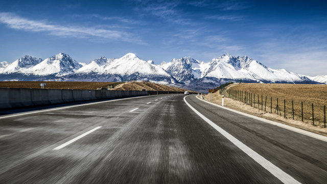 Car on highway and Tatra mountains, Slovakia