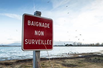 French sign of a non supervised swimming lake
