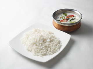 Idiyappam with coconut milk served in a white plate