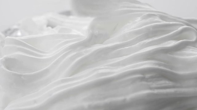 Filling whipped cream. White gentle cream. Close-up shot.
