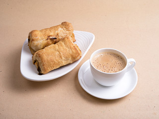 mushroom puffs served in a white plate with tea 