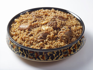 mutton biriyani served in a bowl on white background