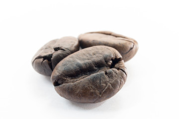 Roasted coffee beans on white background