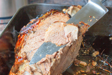 roast lamb lamb oven dish being carved