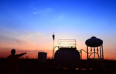 The oil tank, under the background of the setting sun